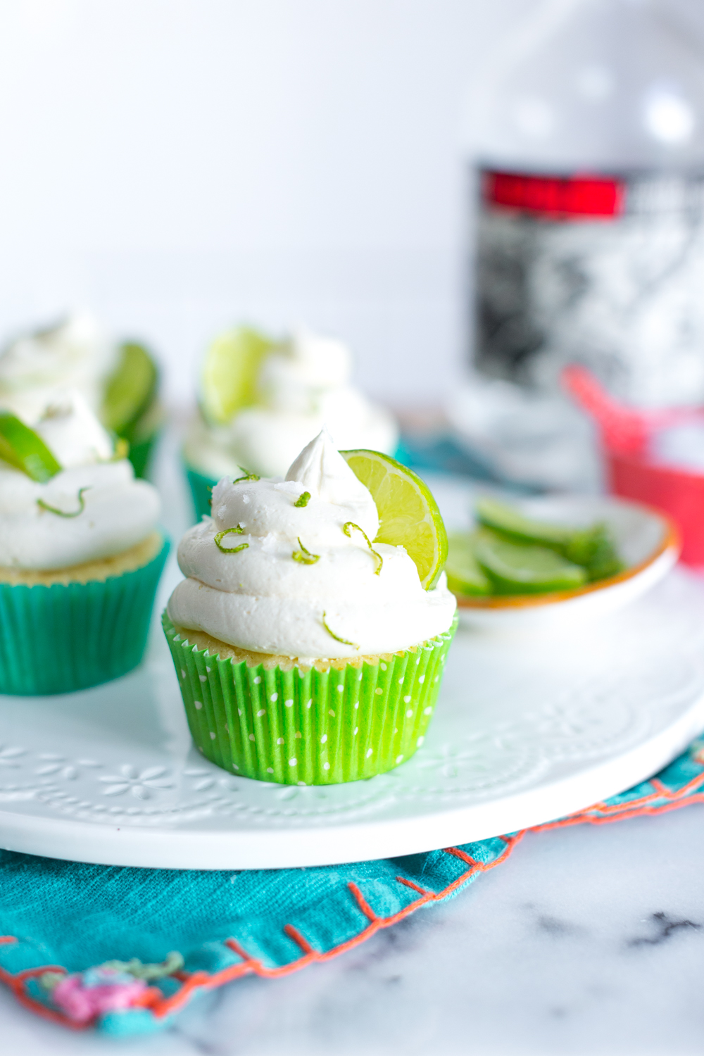 Margarita Cupcakes garnished with lime, tequila and a hearty sprinkle of crunchy salt.