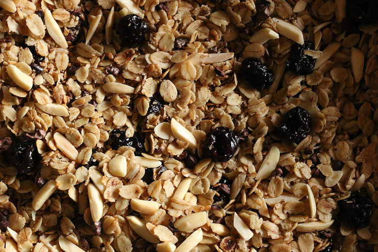 Flaxseeds, almonds, cherries, cacao nibs, and gluten free oats mixed together.