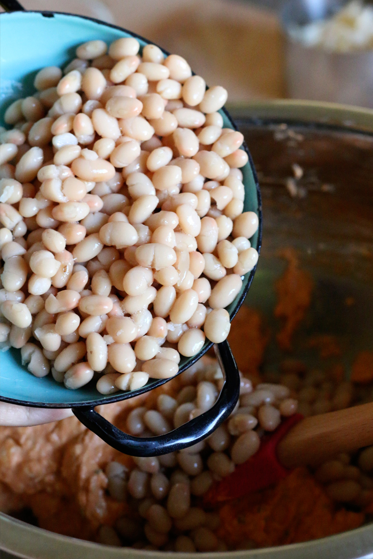 Stir the beans in with the cheese mix and you are nearly finished.