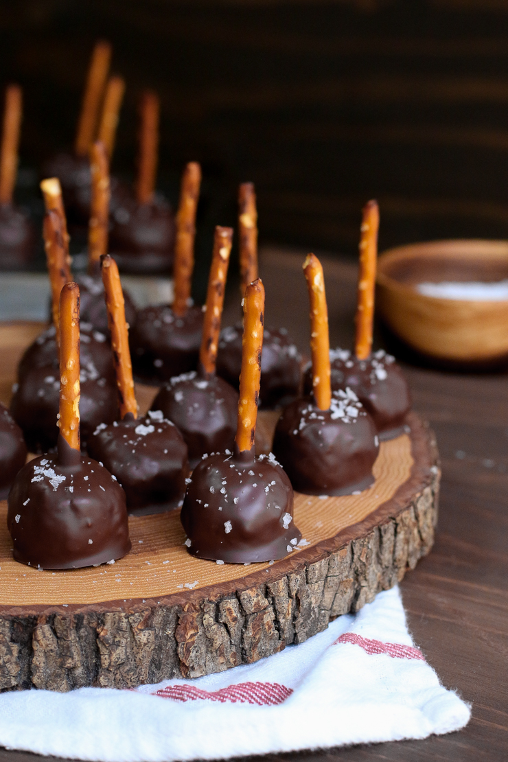 These Chocolate Peanut Butter Pretzel Pops are just so dang cute and festive, they almost look like reindeer antlers.