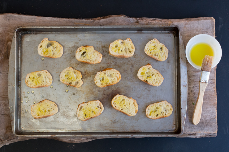 toasting baguette slices for Goat Cheese Apple Hazelnut & Cajeta Crostini toasting baguette slices for Goat Cheese Apple Hazelnut & Cajeta Crostini