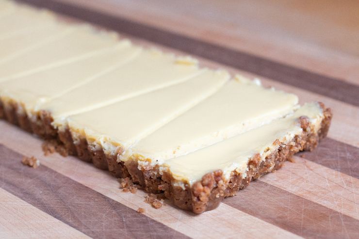 Slice the key lime tequila tart with pretzel crust into wedges. I got 9 full wedges plus 2 small sacrificial end pieces.