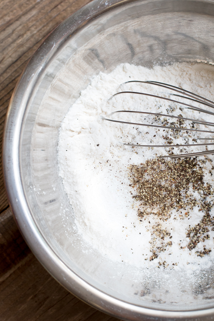 Cracked pepper crust dry ingredients whisked in a bowl