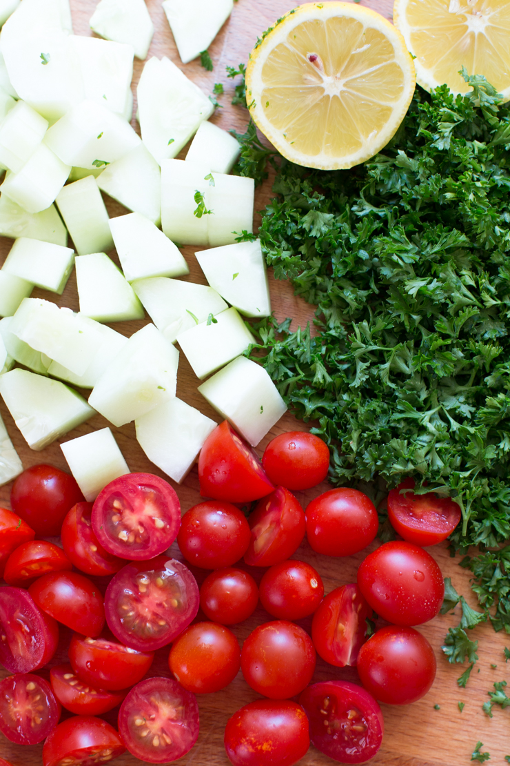 cherry tomatoes, sliced cucumber, freshly chopped parsley and lemon