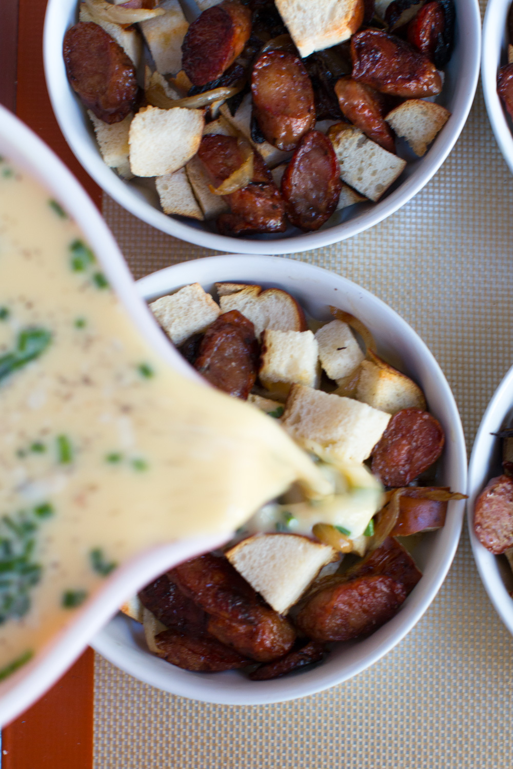 Sausage Gouda and Pretzel Strata egg pour