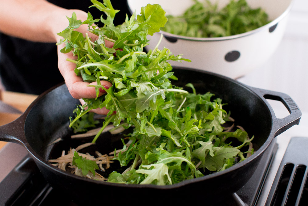 Baked Eggs with Ricotta, Greens & Sun Dried Tomatoes baby kale and arugula