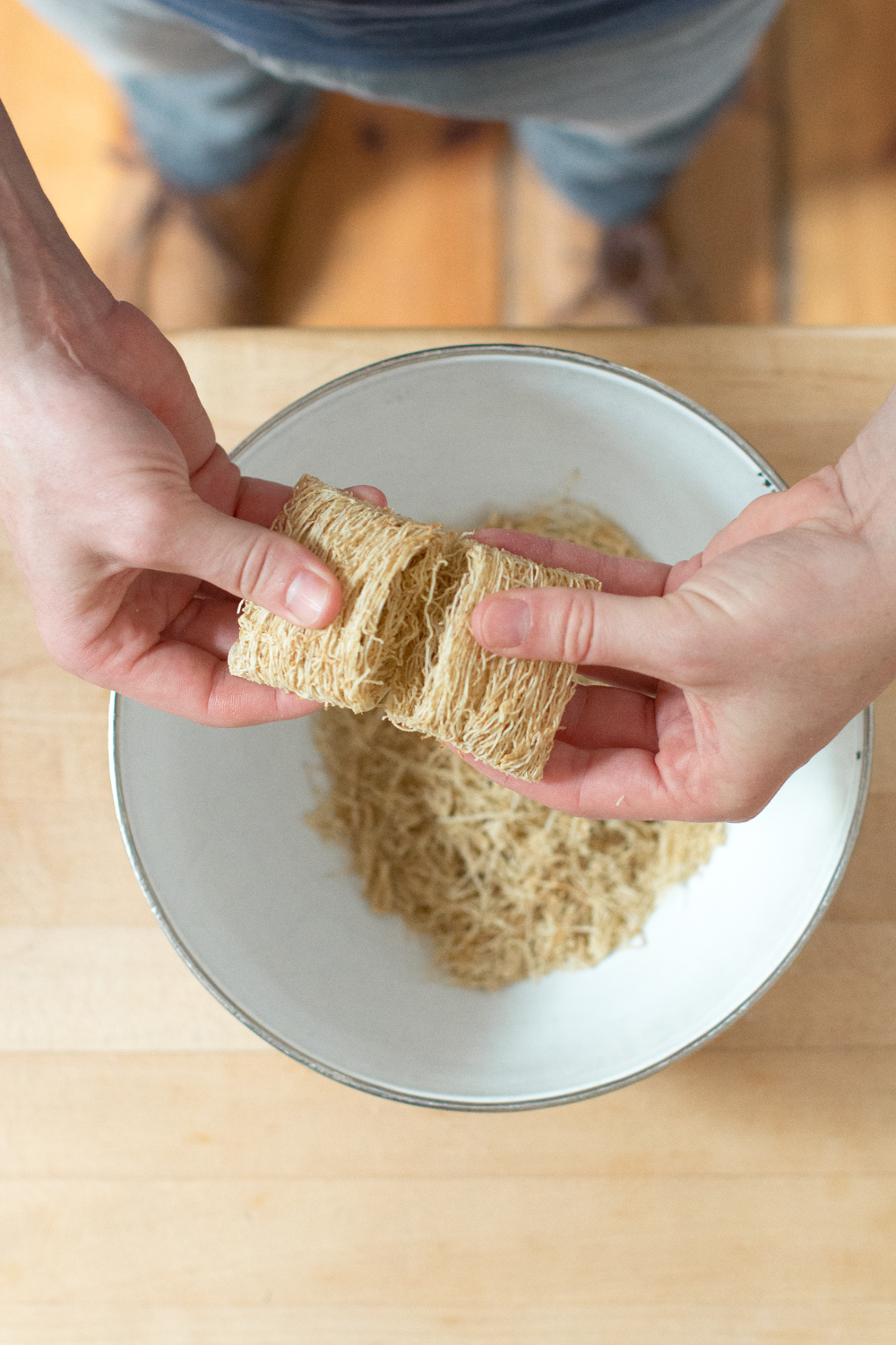 Gently pull apart the shredded wheat by hand