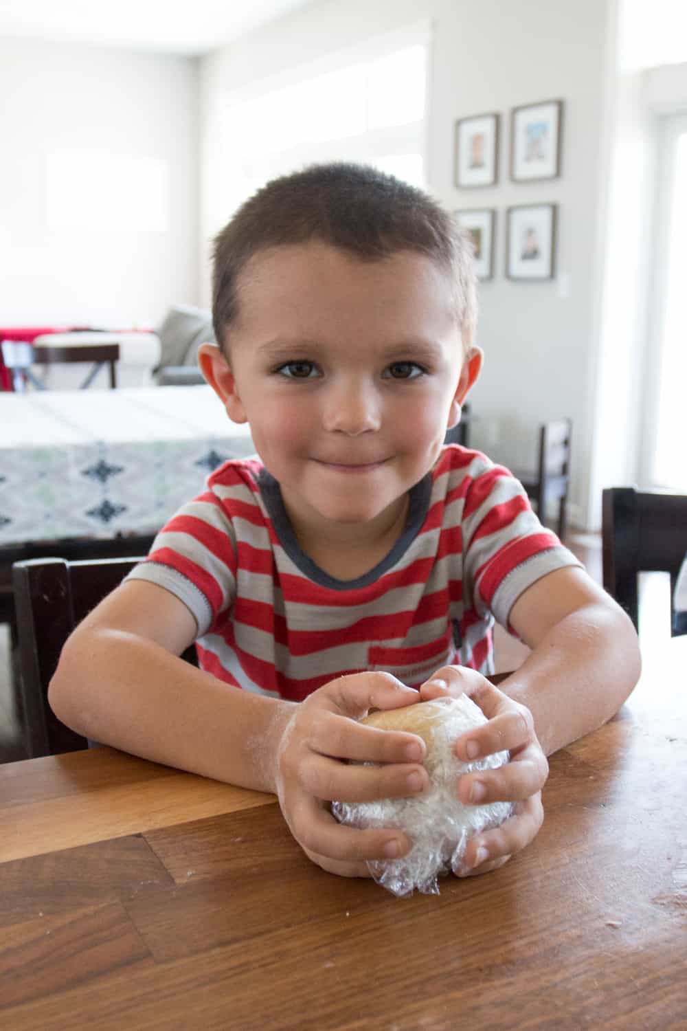Vincent gathering his dough scraps into a perfect ball