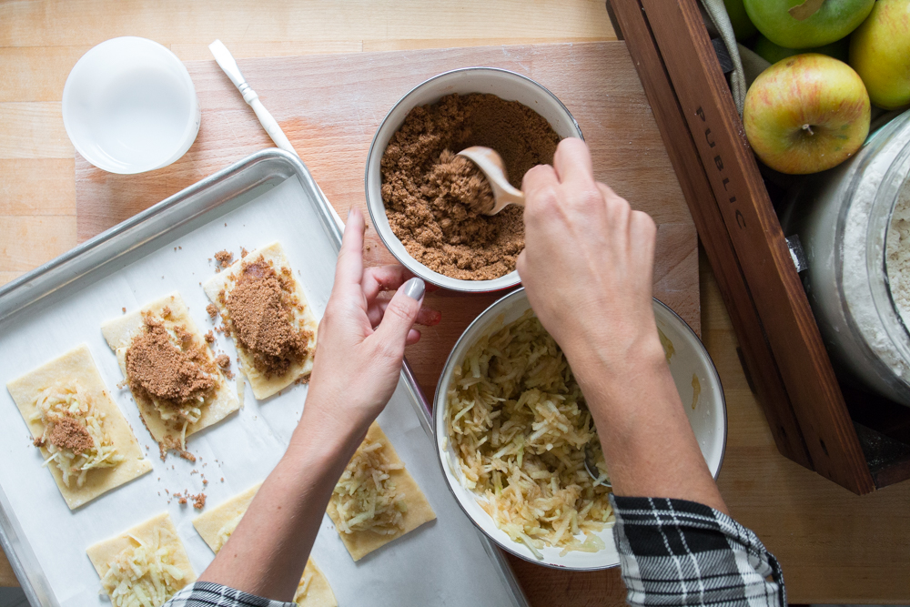 First layer on the grated apples and then top them with the brown sugar cinnamon mixture for full on Fall flavor!