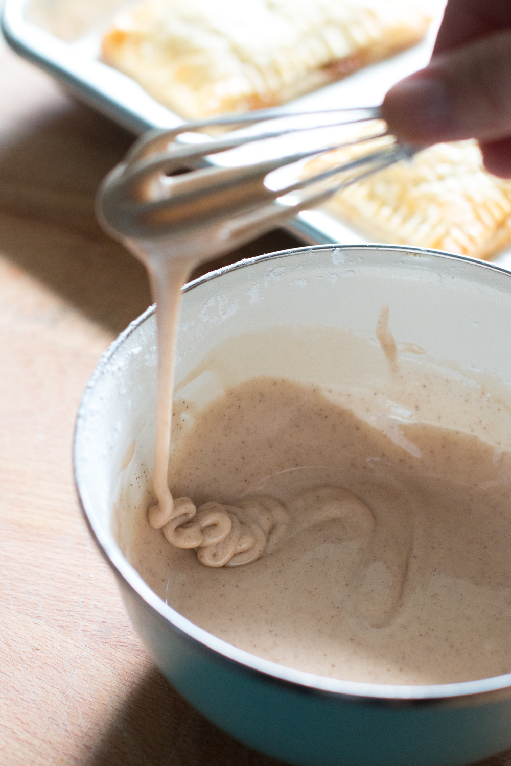 The maple glaze should run off a whisk like thick molasses