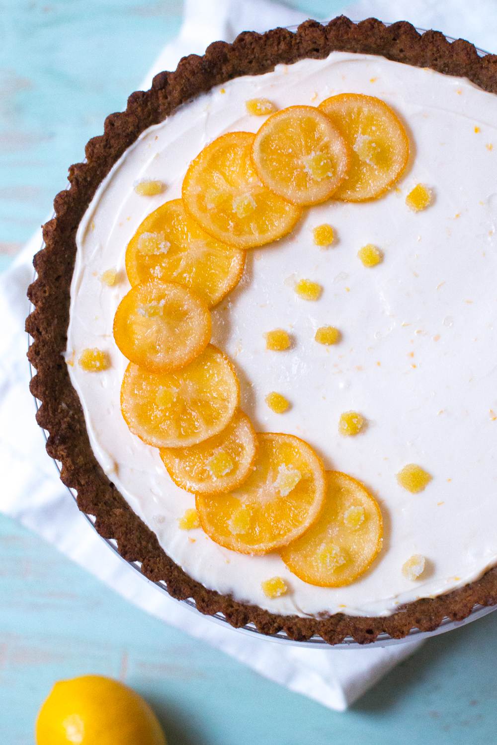 Top the Meyer Lemon Ginger Molasses Tart with the candied meyer lemon and ginger