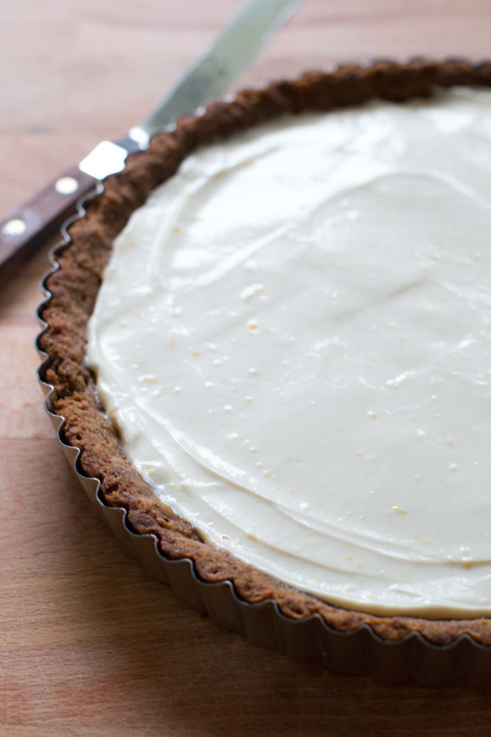 Fill the baked and chilled ginger molasses shell with the creamy meyer lemon and ginger mascarpone filling