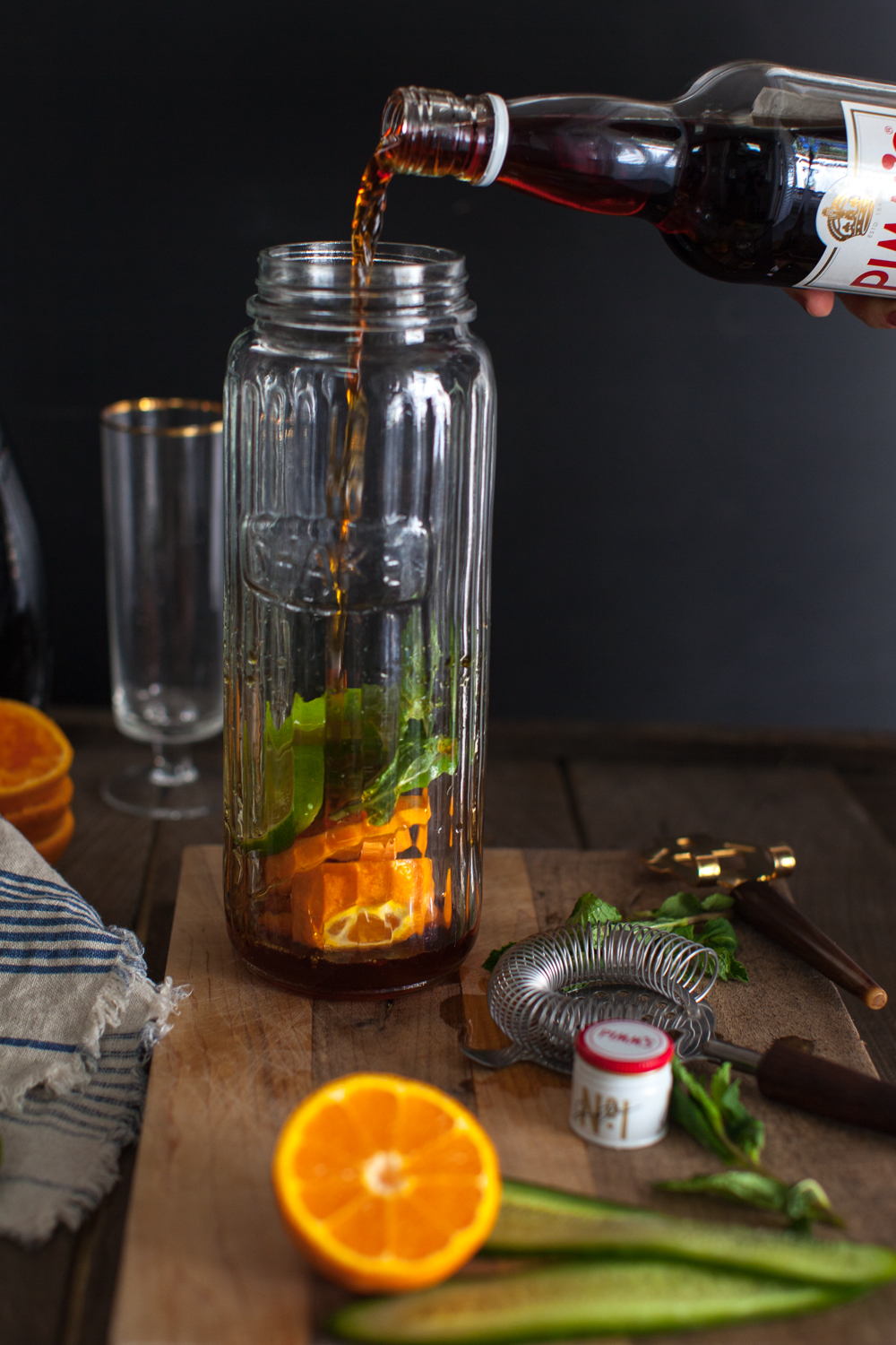 Pour the Pimm's right in with the fruit so they can hang out a bit and become flavor buddies. 