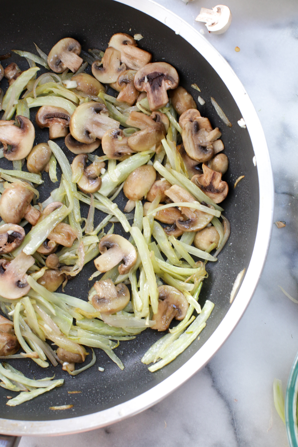 Sautéing the fennel, shallot, mushrooms and garlic