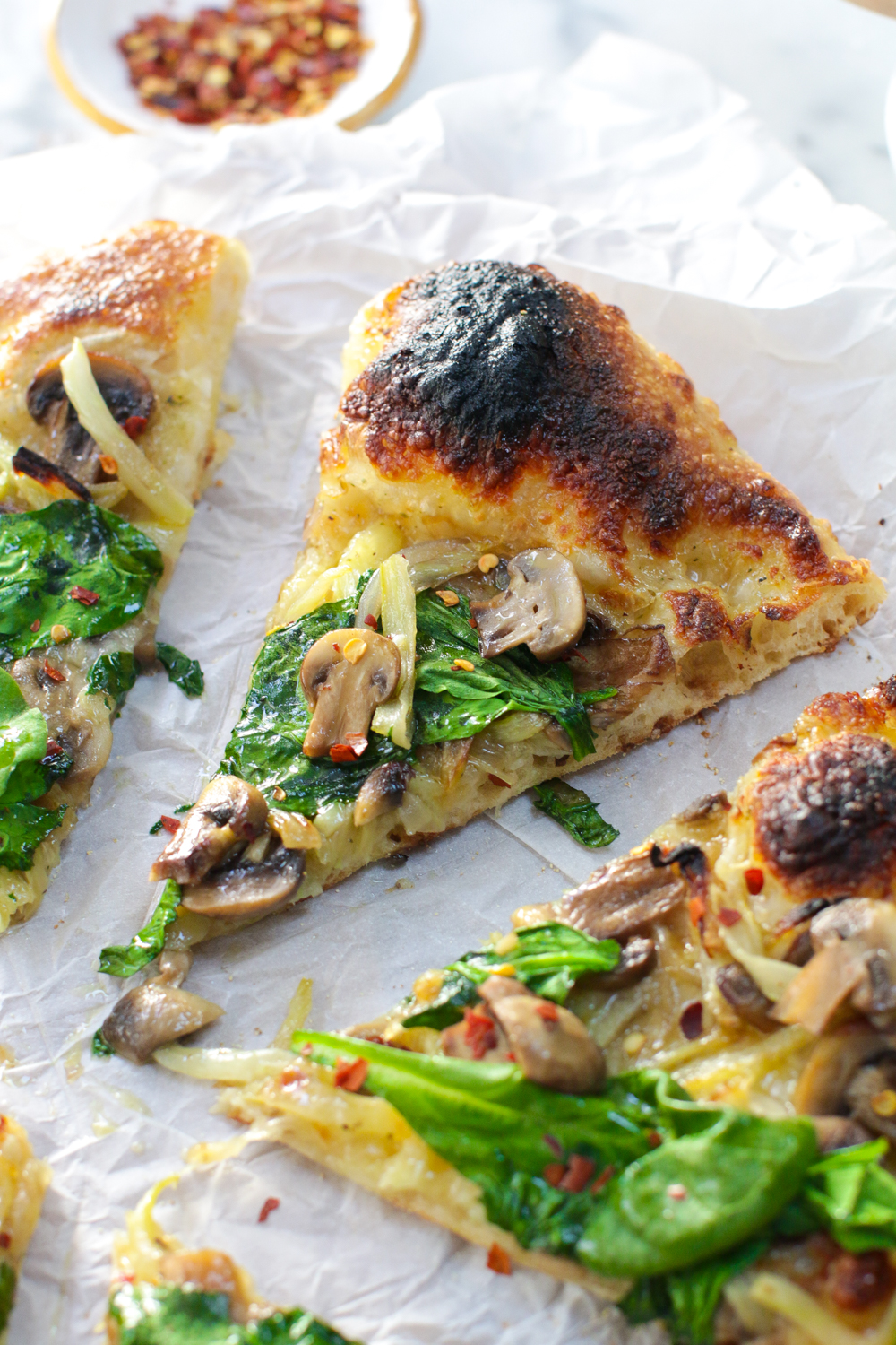 Charred bubble on the Garlic & Fennel Mushroom Pizza.