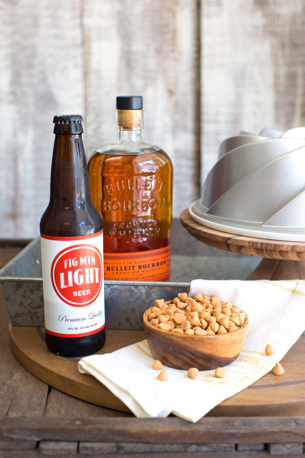 This One Bourbon, One Scotch, One Beer Bundt Cake has it all. Straight bourbon in both the cake and glaze, butterscotch chips and a a butterscotch glaze and a single ice cold beer in the center of the bundt!