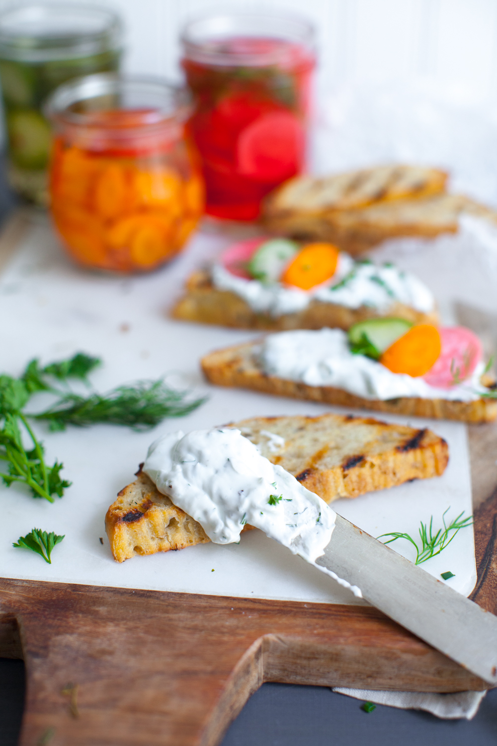 Slather the toasty grilled bread with a schmear of the herbed skyr