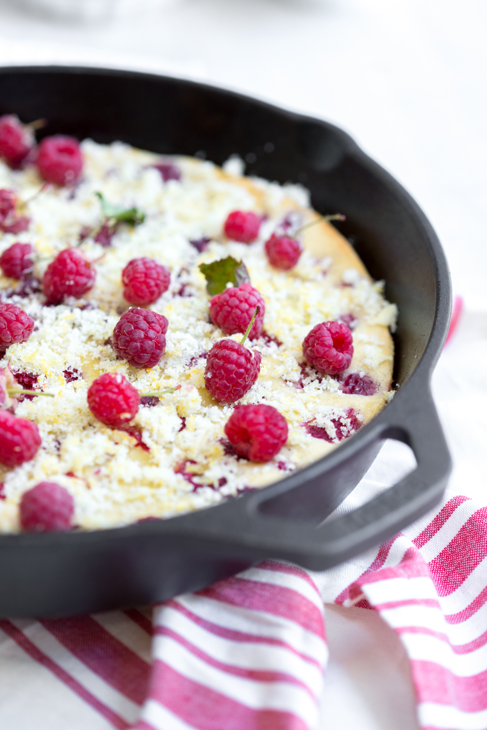 Raspberry Buttermilk Clafoutis with fresh berries.