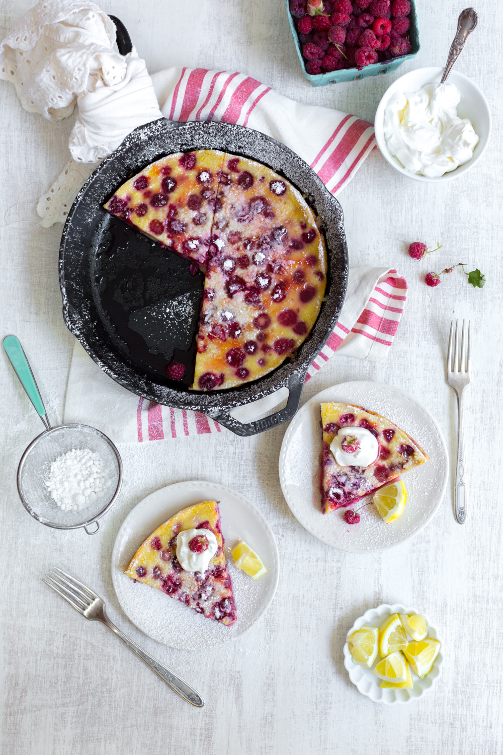 If you let the Raspberry Buttermilk Clafoutis the sugar will start to soak in and make a deliciously sweet and tangy syrup. Top with a sprinkle of powdered sugar and a dollop of rich crème fraîche.