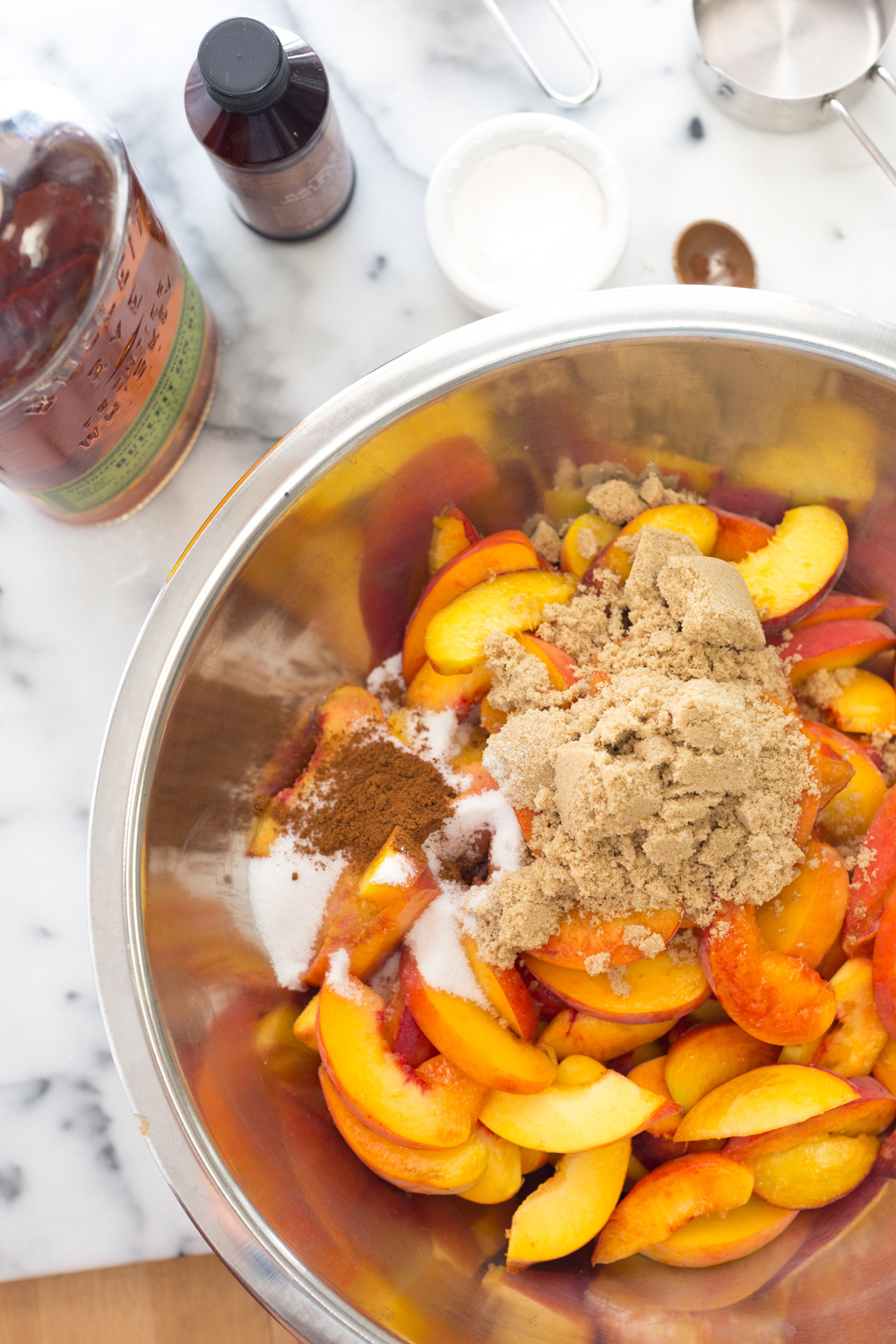 Rye Rye Peach Pie filling in a mixing bowl