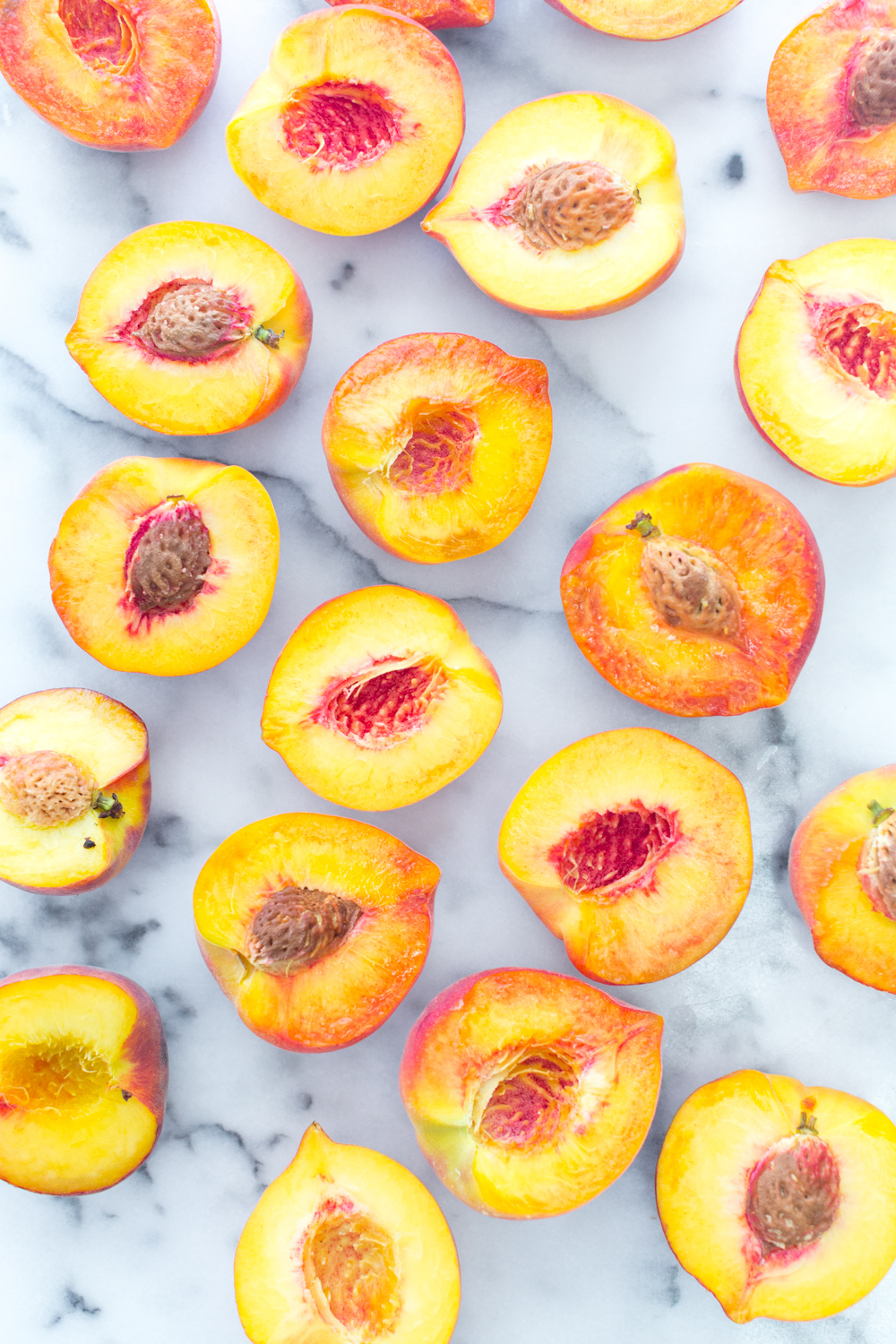 Halved and pitted peaches