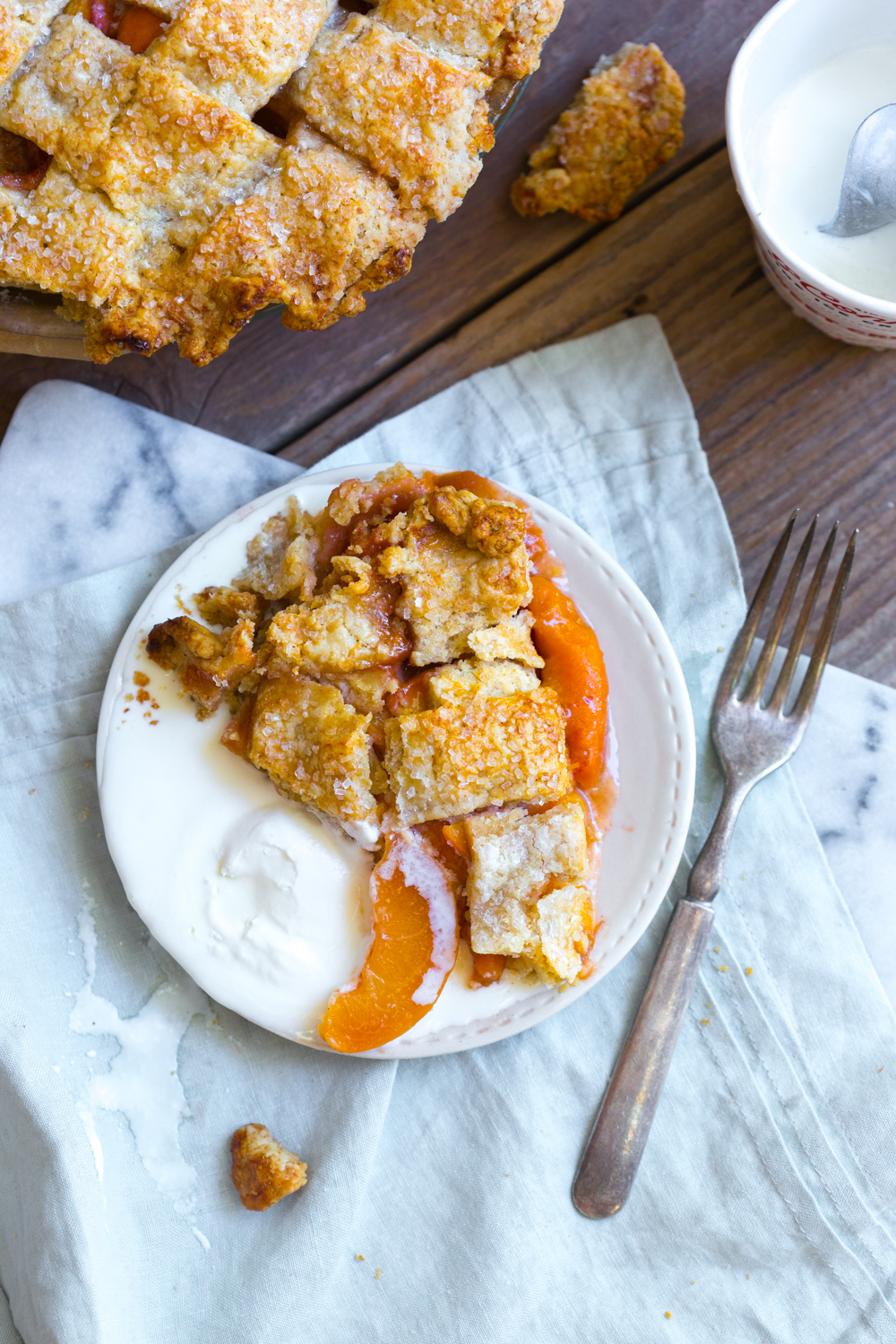 A slice of Rye Rye Peach Pie with McConnell's ice cream.