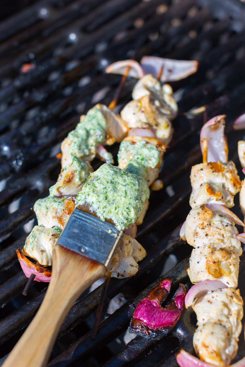 Baste the grilled chicken skewers with Herby Feta Sauce.