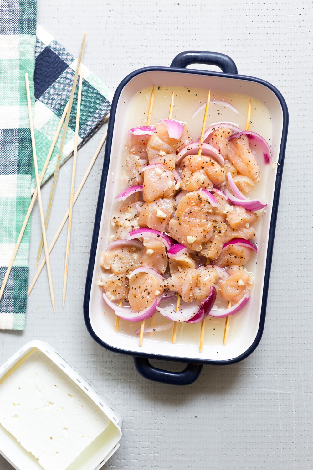 Marinating Feta Brined Chicken Skewers in feta brine