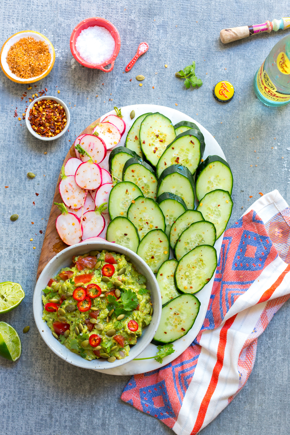 Guacamole with Spicy Cucumbers and Radishes, with an icy cold bottle of Topo Chico all I need in life right here.