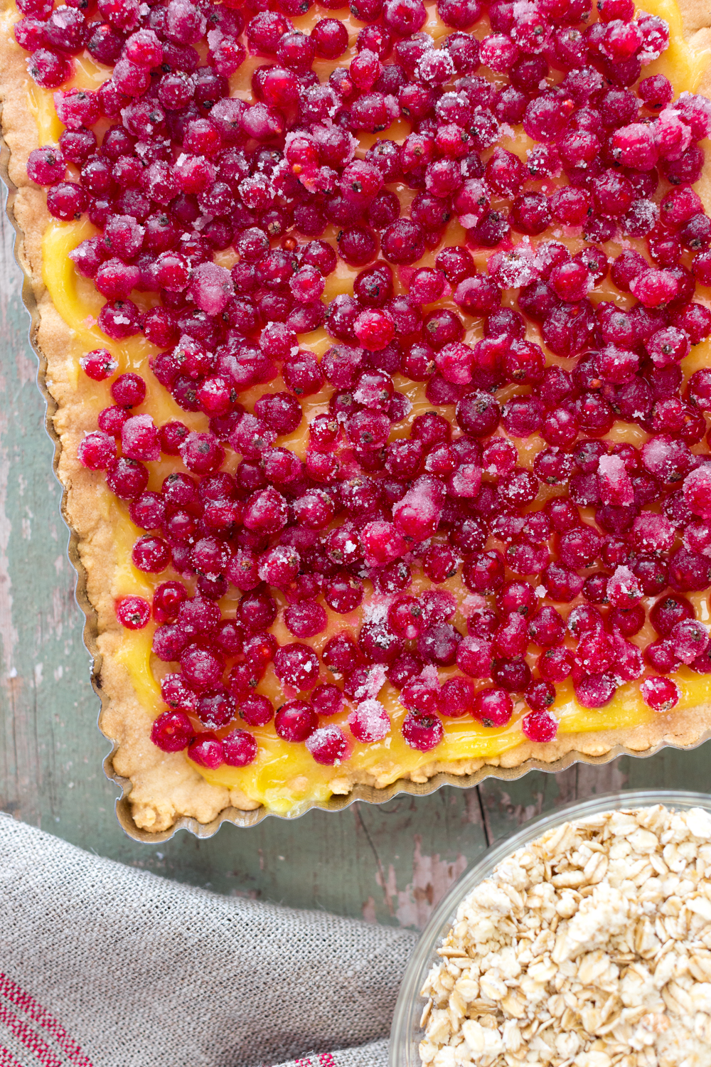 Lemon curd and red currants in a shortbread crust.