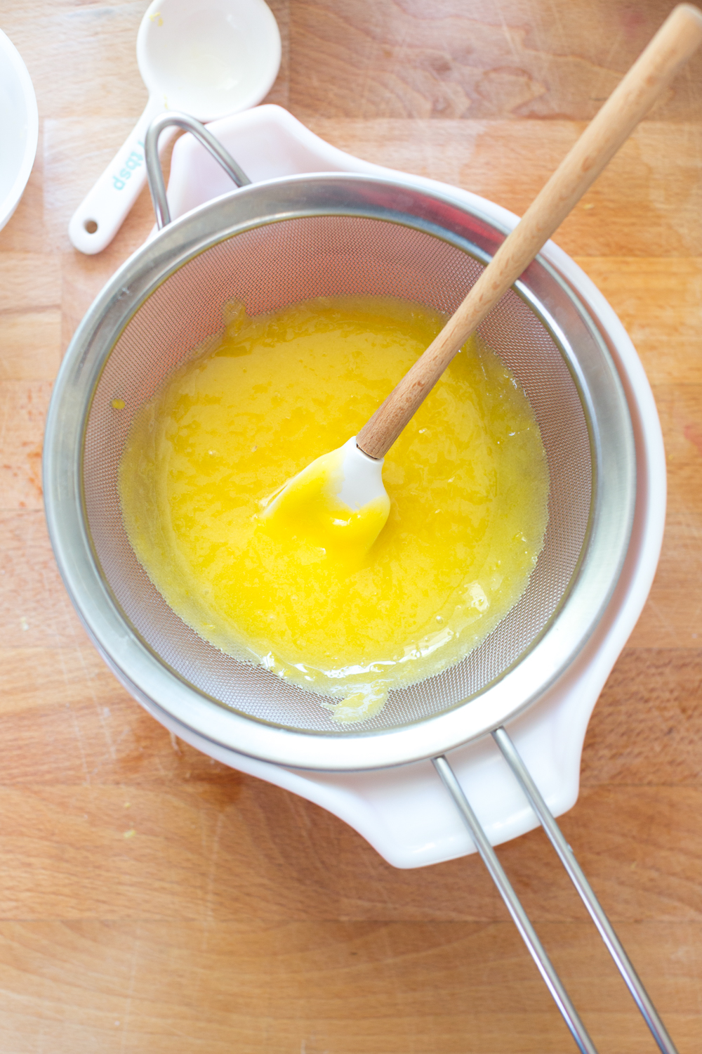 straining lemon curd