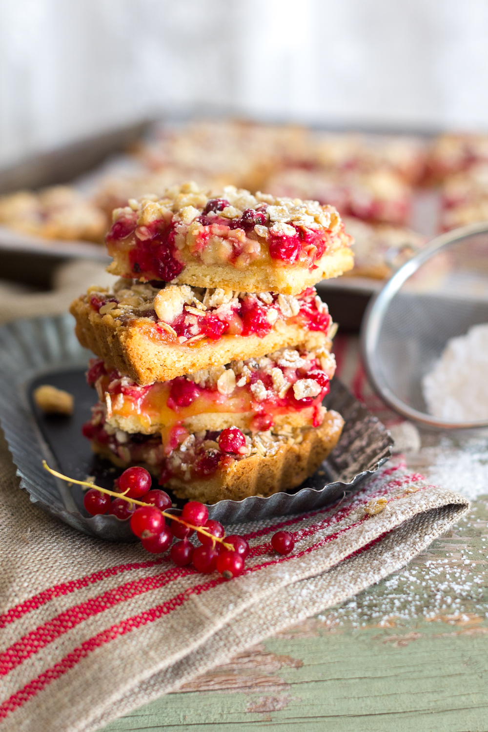 Red Currant Lemon Crumble Bars stacked.