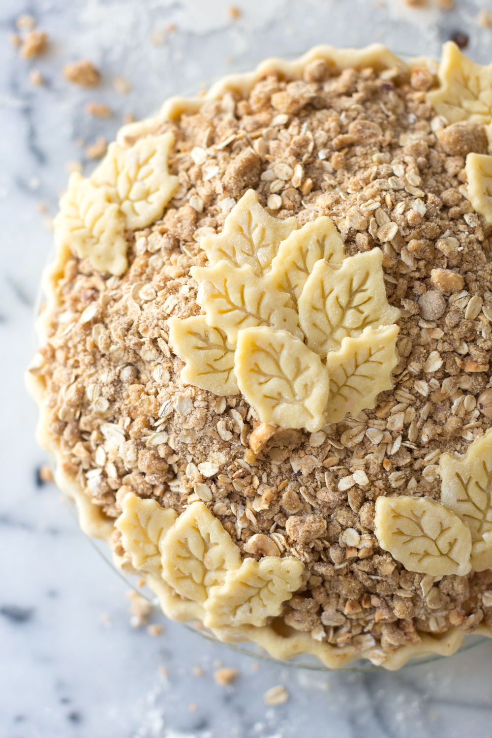 Crust leaves on top of the Cranberry Apple Brown Butter Crumble Pie close up.