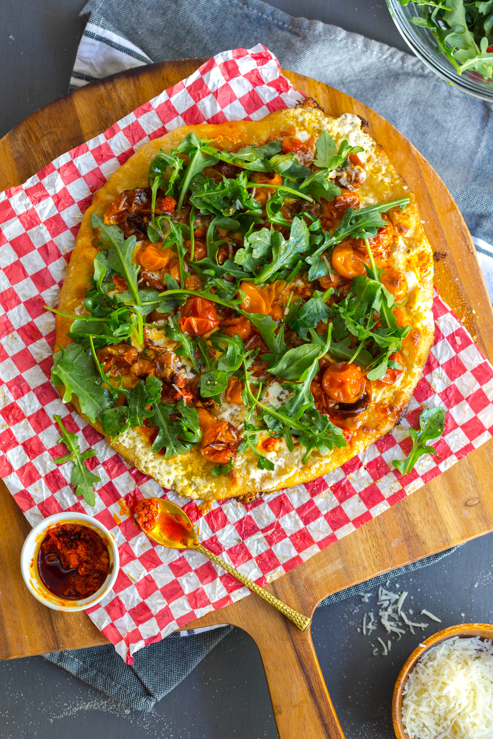 Tomato Confit Burrata and Arugula Pizza baked