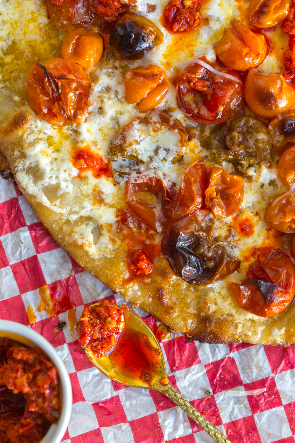 Tomato Confit Burrata and Arugula Pizza fresh from the oven