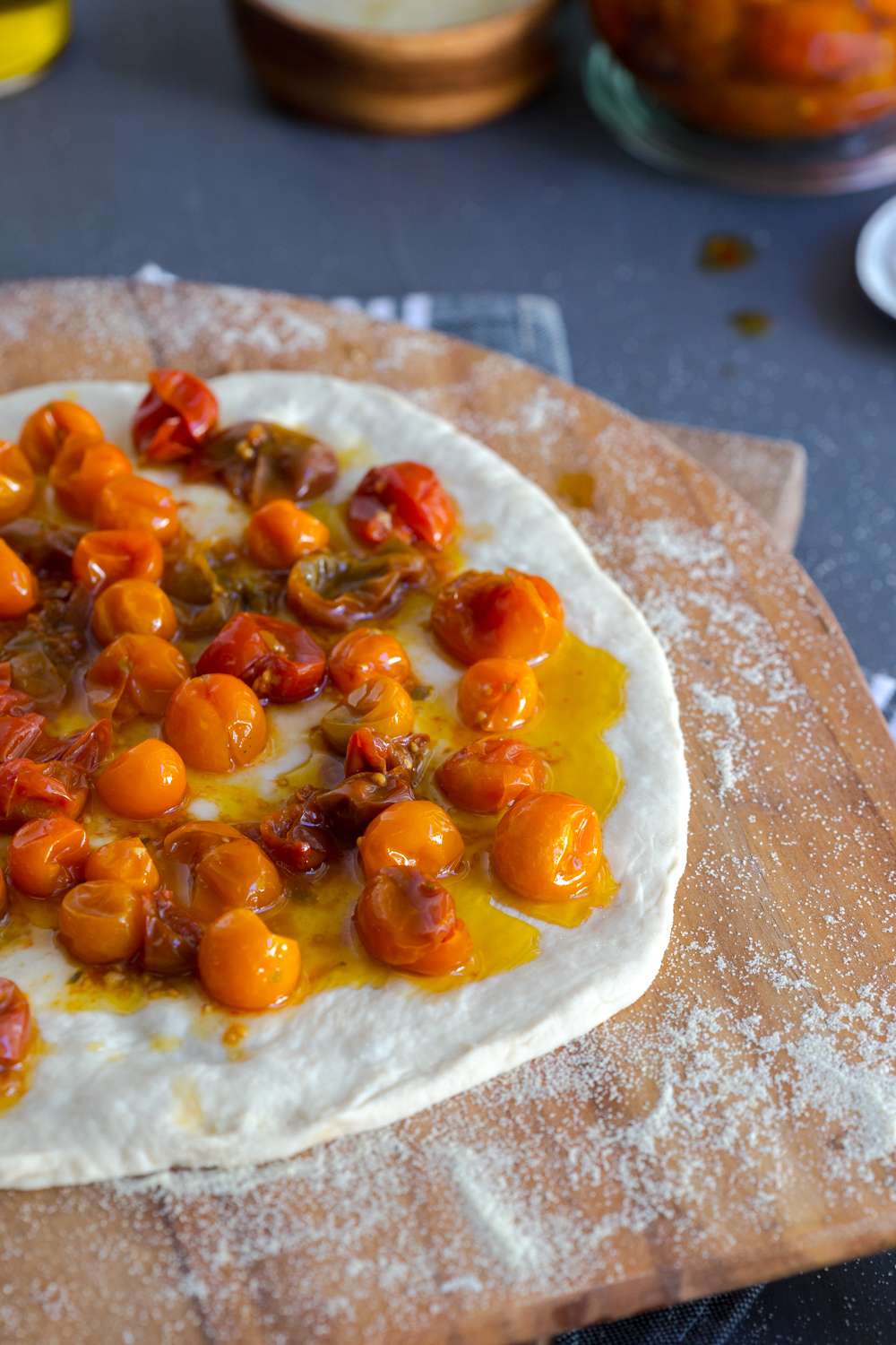 Building Tomato Confit Burrata and Arugula Pizza