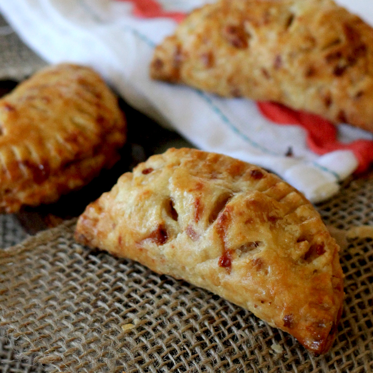 Apple handpies with a flaky cheddar crust.