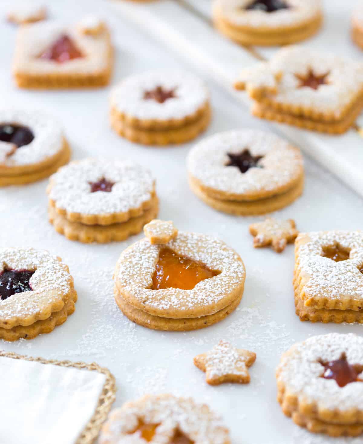 Hazelnut Linzer Cookies with Wine Jam photographed at an angle with a narrow depth of field
