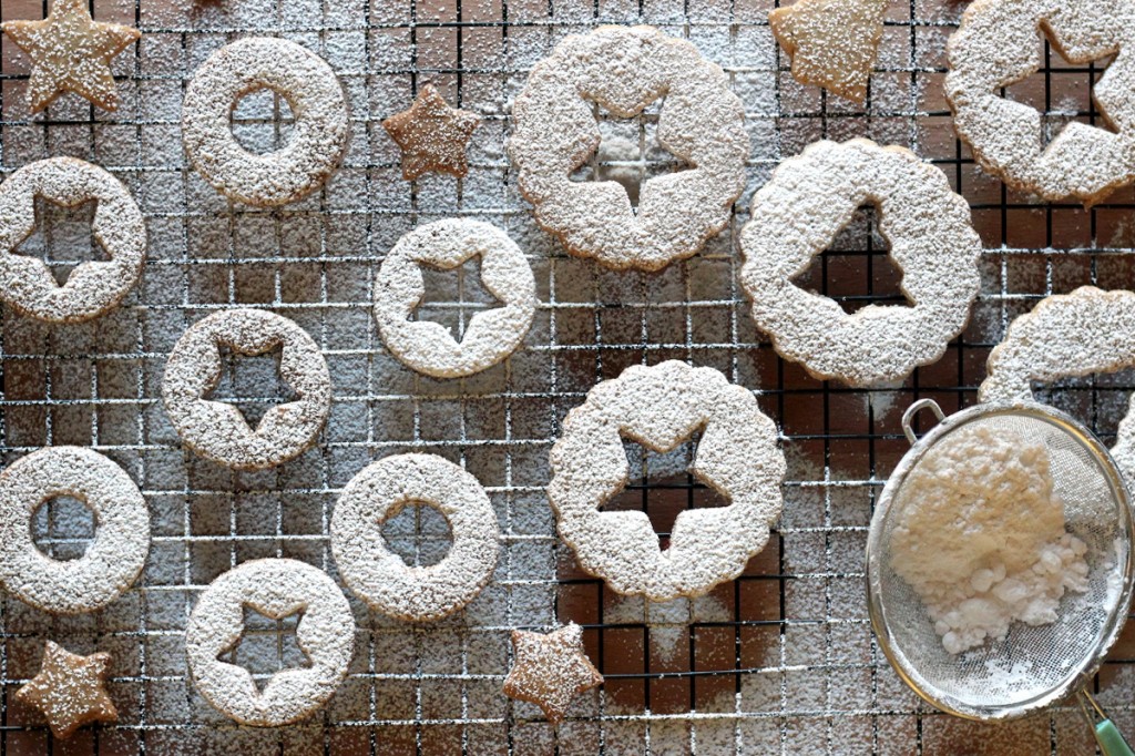 Sifted powdered sugar on Linzer Cookies