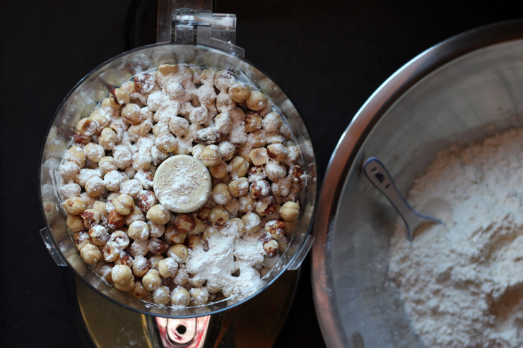 grind hazelnuts into a flour with a food processor