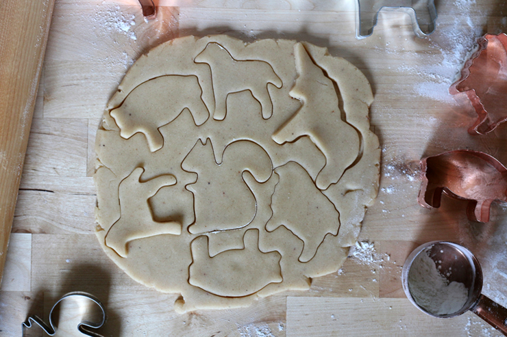 cookie dough cut into animal cookie shapes