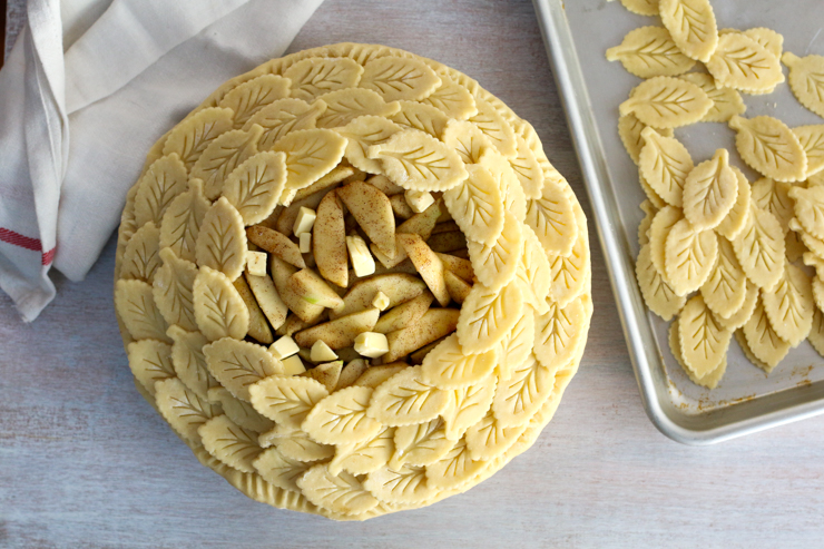 decorating pie dough with leaves