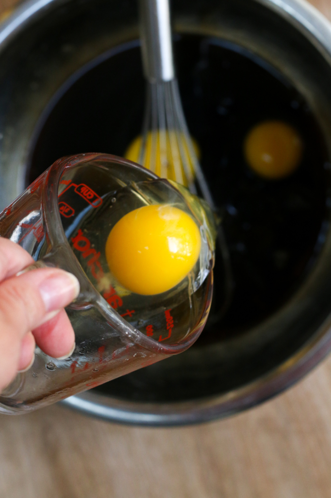 Whisking eggs into cooled pecan pie filling