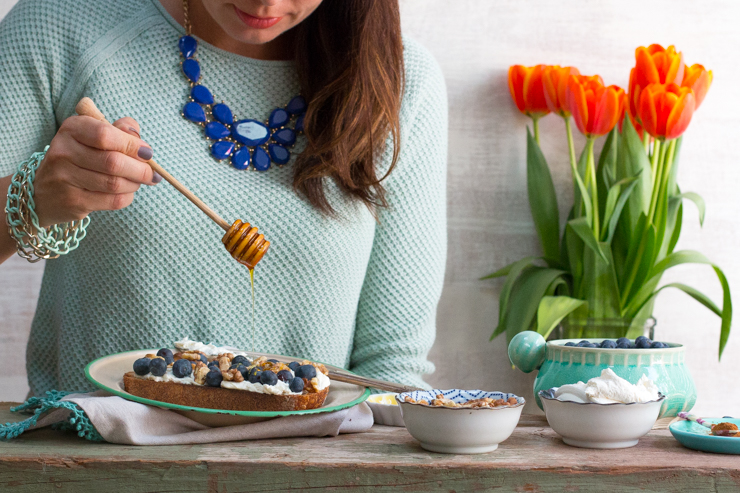 Drizzling honey on Blueberry Walnut Toast