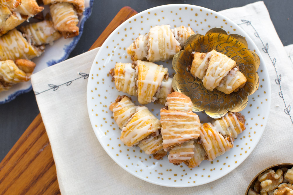 Maple Walnut Rugelach on a decorative plate - overhead, styled background