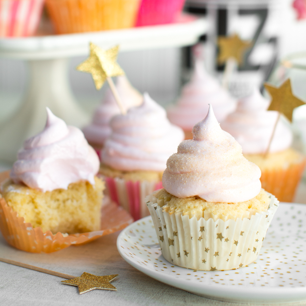 a close up shot of pink champagne meringue cupcakes