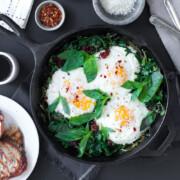 Baked Eggs with Ricotta, Greens & Sun Dried Tomatoes