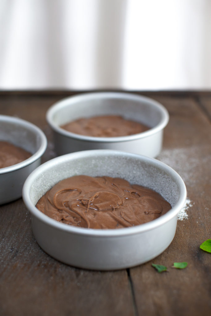 chocolate cake batter in 3 6" pans