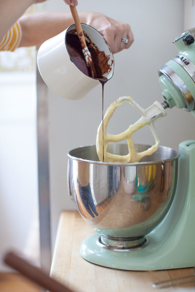 Mixing chocolate into cake batter