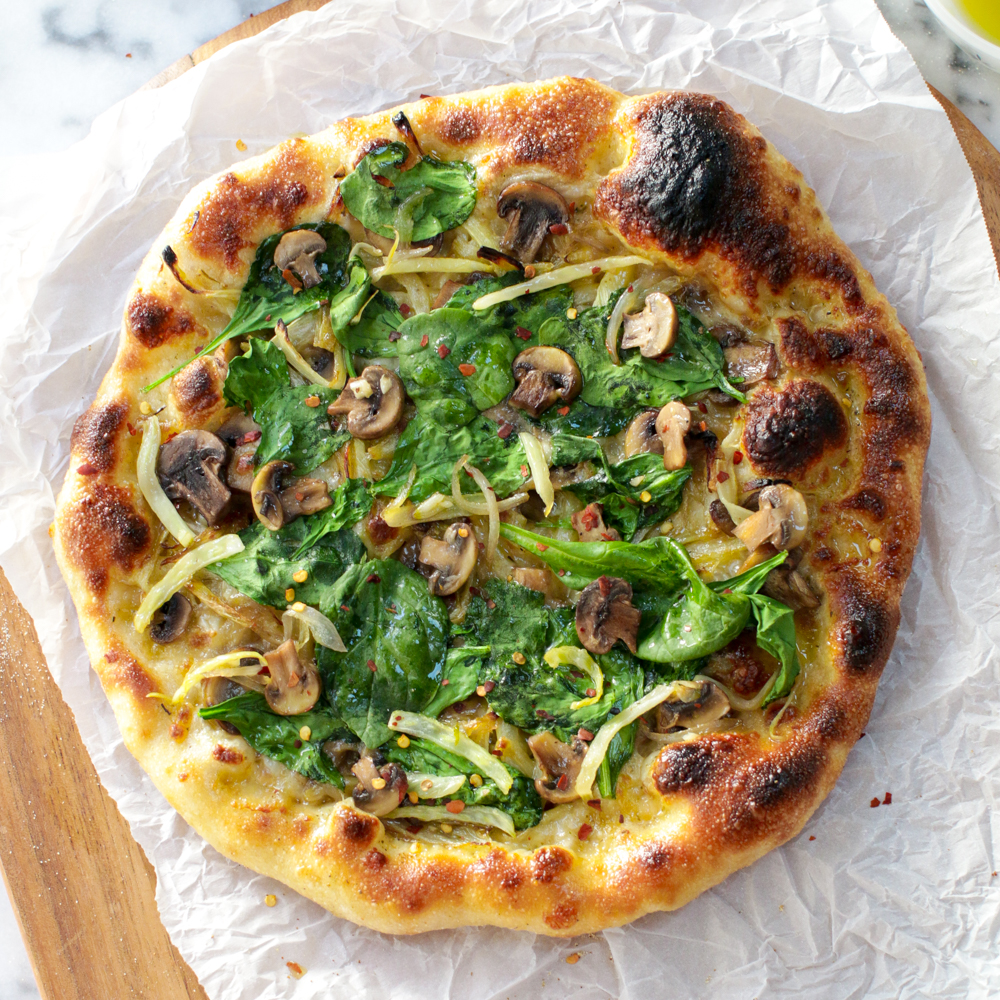 Garlic & Fennel Mushroom Pizza adapted from the original recipe from Life Is But A Dish and baked on Baking Steel.